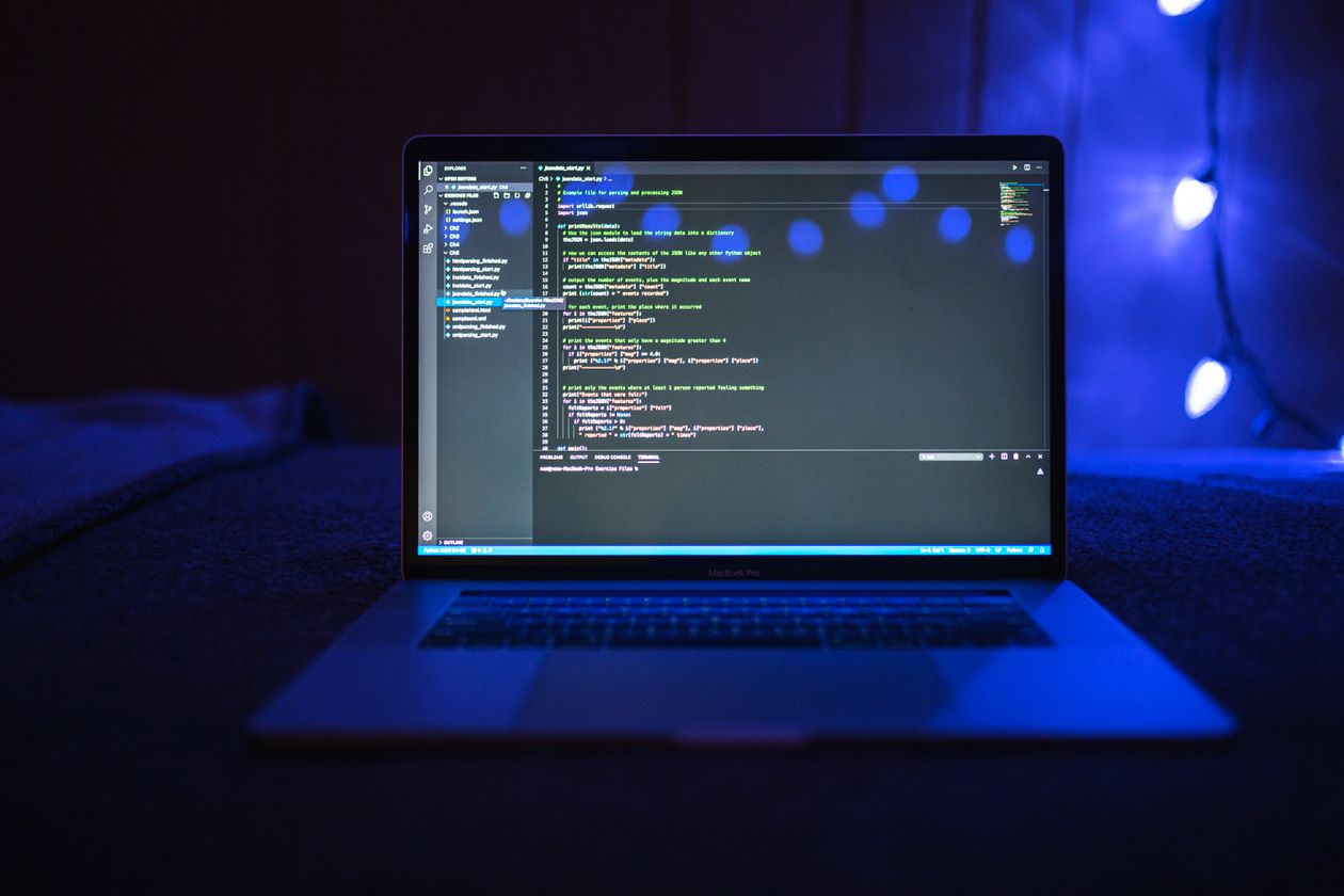 Dart null safety code shown on a laptop screen
